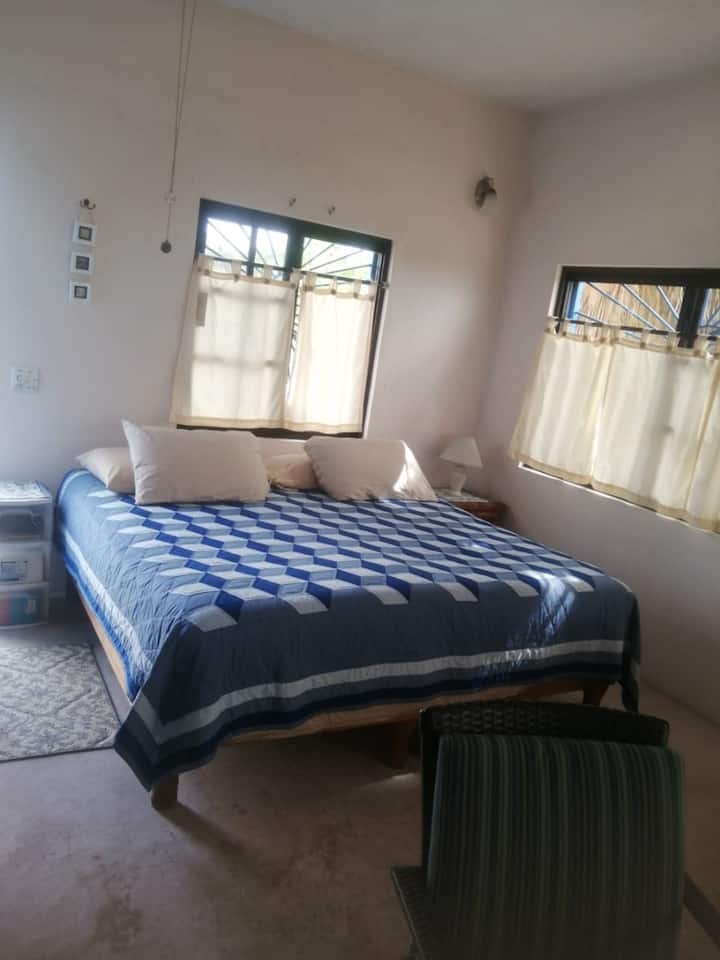 King bed with view of ocean through the window!