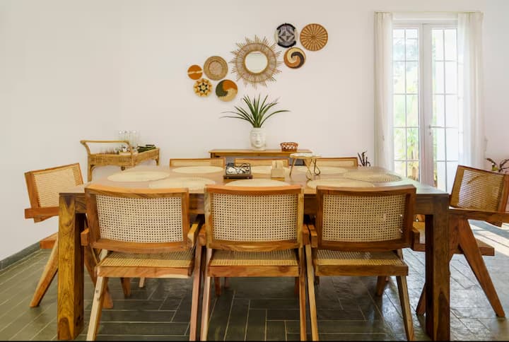 A beautifully designed dining area offering a spacious layout and comfortable seating, perfect for l