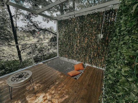 Container in the forest, jacuzzi, campfire