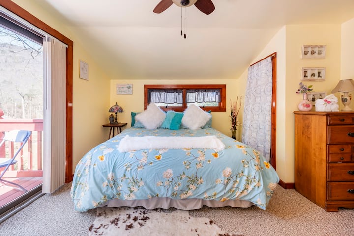 Bright bedroom with queen bed at Serenity Retreat