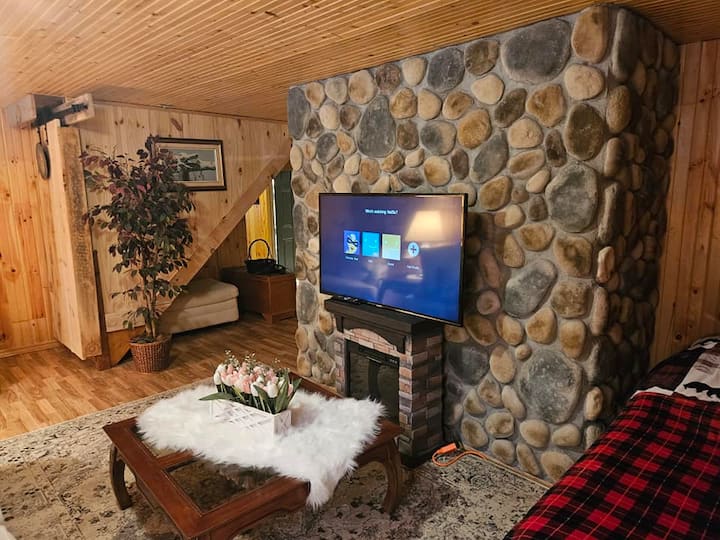 A total of 2 TVs are provided.  1 in the Family Room (40") and the other in the Living room with 50", both with Netflix.   Family room and living room have electric fireplaces.