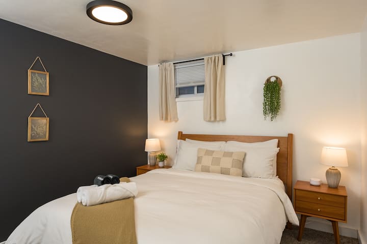 Bedroom 5 is a queen bed on the lower level/basement floor with comfortable, plush linens and a memory foam mattress for a great night's rest!