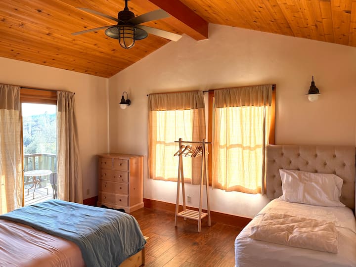 Interior of Bonnie Bungalow with queen bed and twin bed. 