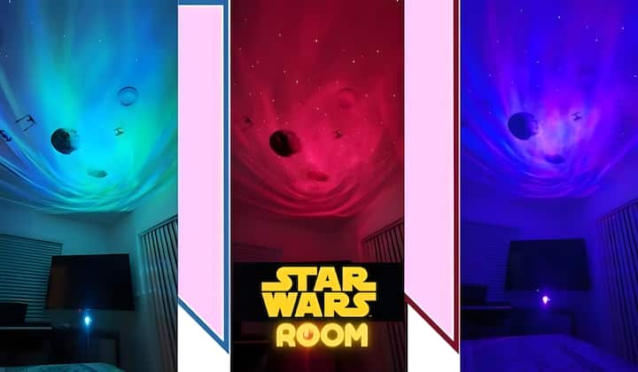 Star Wars-themed room with direct jacuzzi access, garden-view window, red-blue universe lighting, TV, closet, USB reading lamp, and 110V outlets.
