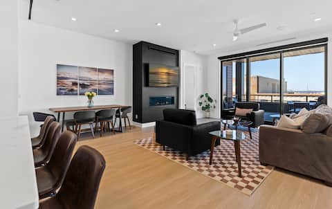 Luxe Downtown 2BR Condo • Walkable • Parking + Gym