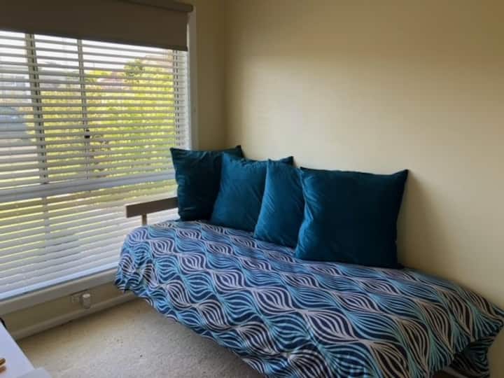 Single futon shown set up as a daybed. 

Bedroom 3 also contains the work space 