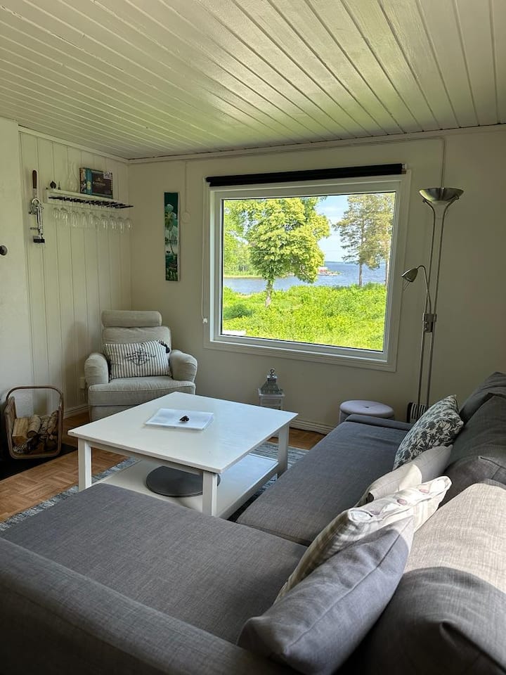 The living room has large window with a view of Lake Mälaren.