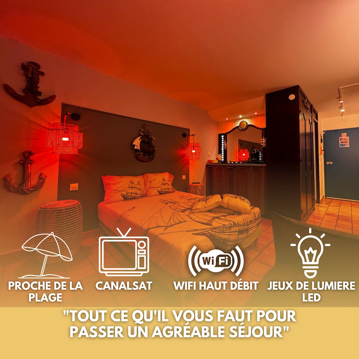 A cozy sleeping area features warm lighting and nautical-inspired decor. A spacious double bed is complemented by soft linens, while walls adorned with art and shelves enhance the inviting atmosphere. Noticeable are amenities such as WiFi and a TV, contributing to a comfortable stay.
