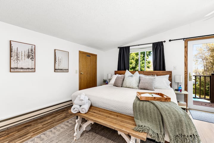 Retreat to our spacious master bedroom, featuring a plush king bed that promises a restful night’s sleep. Thoughtfully designed for comfort and relaxation, this inviting space is your personal sanctuary after a day of exploring.
