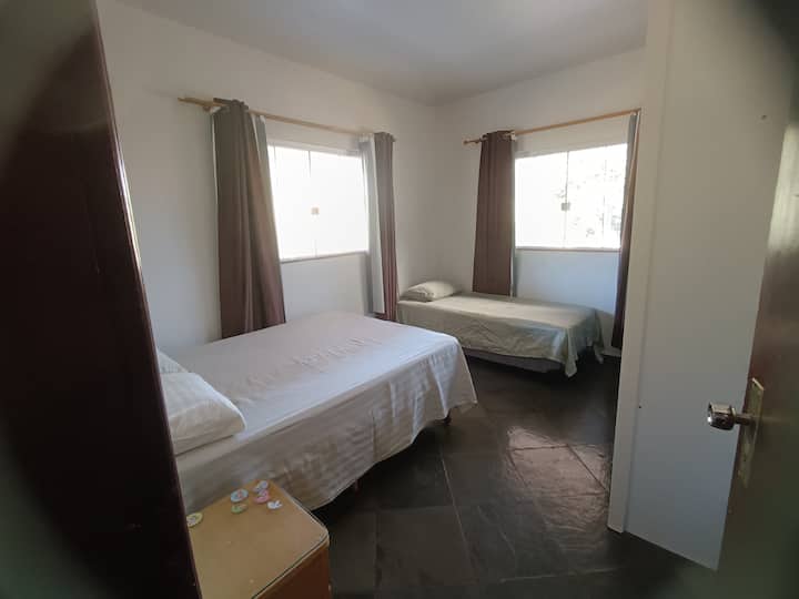 Ground room with 1 double bed and 1 single bed.