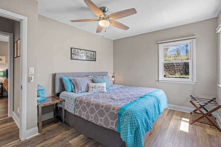 Second bedroom with king size bed and blackout honeycomb shades 