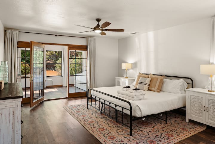 Bedroom 1 boasts a king-sized bed in a beautiful space that exudes stylish simplicity. The trundle bed (Bedroom 2) is in the adjoining sun room.