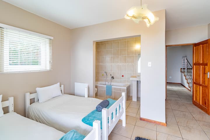 Two single beds with heated blankets and an ensuite bathroom 
