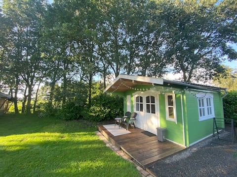 Log cabin in the meadows on a small campsite