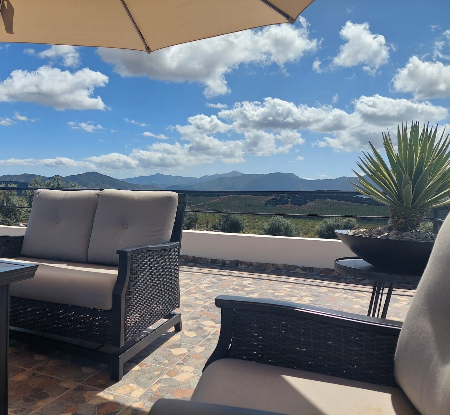 Rooftop seating with a view across the valley
