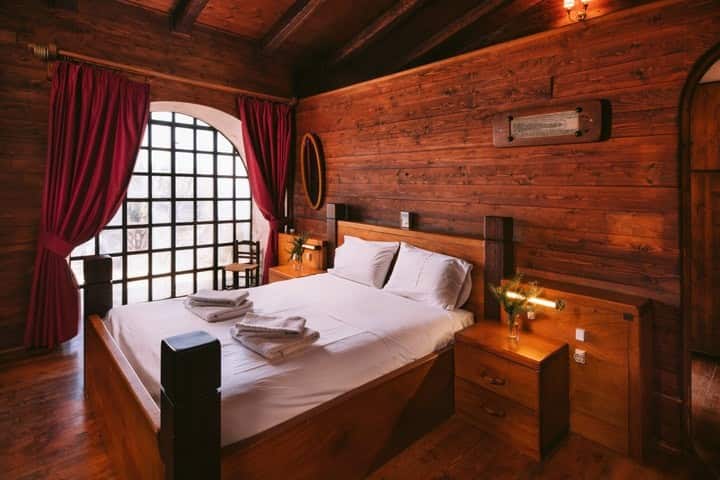 Master bedroom, with en suite bathroom and bathtub. Sea views from the bed - no need to get up! This bedroom is in its own building, and has a study/office/living room  attached to it. The office/living room can be converted into an extra bedroom.