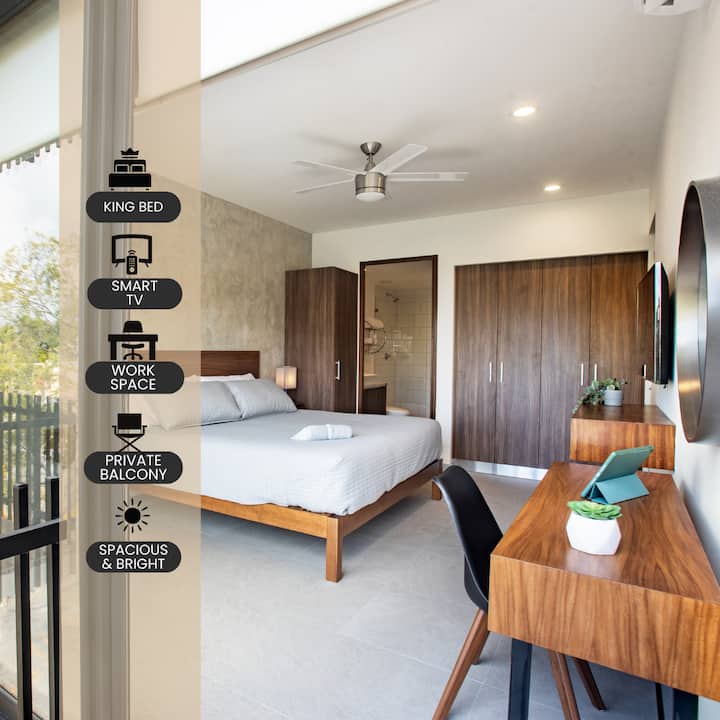 Very spacious and bright primary bedroom. Designated work space and lots of closet space. Also has lamps with charging stations and plugs. Also has it's own private balcony. 
Note:glass has been upgraded to minimize street sounds.