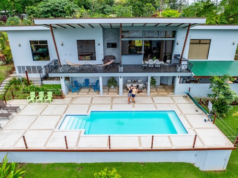House with a pool in front of Lake Cutris