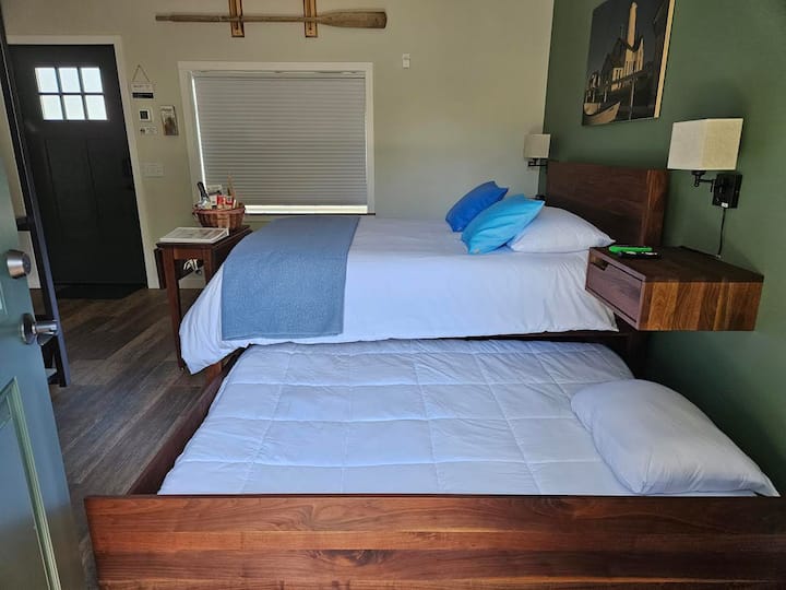 Eac of our rooms include a queen size bed with a full-size pull out trundle bed.