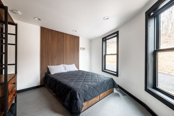 Bedroom 1 with Closet System and 2 Large Windows - Skyline Yurt
