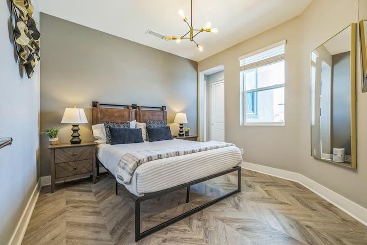 Downstairs Primary Suite with ensuite bathroom and shower, reach in closet, and 58 inch Samsung TV