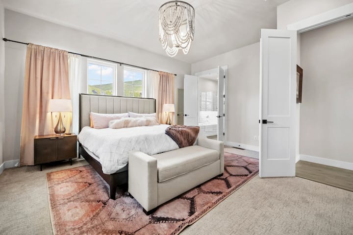 Relax in style beneath elegant lighting and calming tones