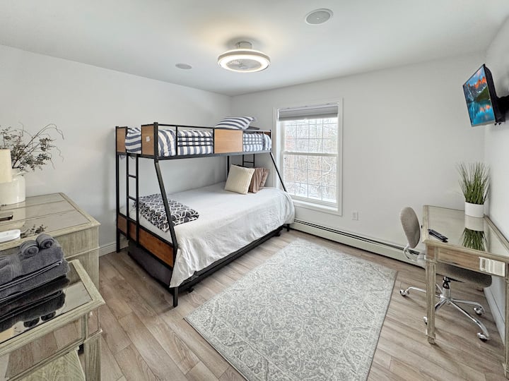 The 3rd bedroom has a twin over a full mattress, a 30 inch HD LCD Smart TV, a dresser and a desk. We also offer an extra trundle bed and a pack and play with infant/ toddler mattress for your little ones.  Sleeps 3+