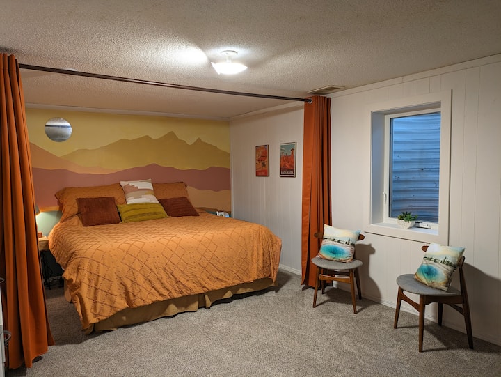 The "Badlands" themed room has a conversation space and a big King-sized bed for relaxing.  The warm colors create a calming vibe. 