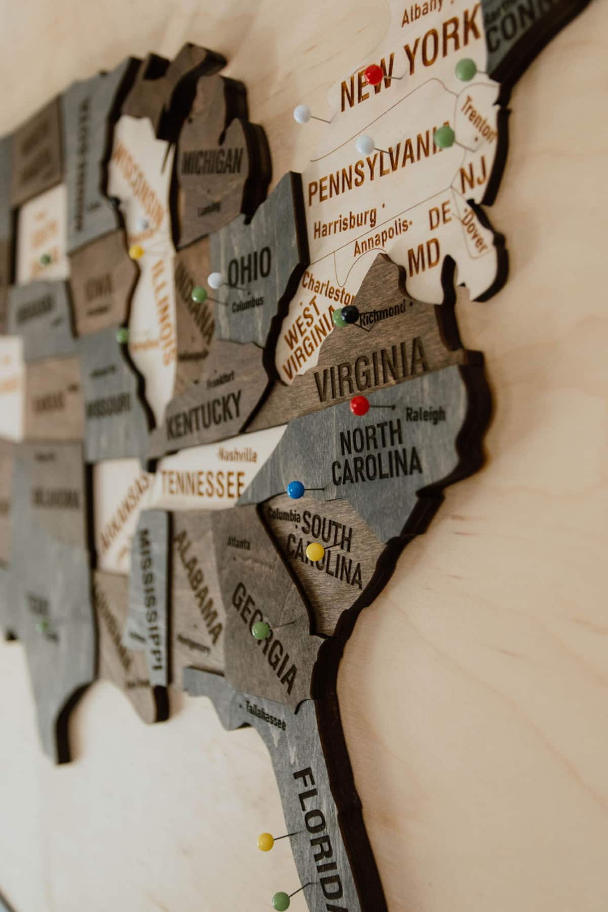 Hand-cut wooden map décor in the game and bar room