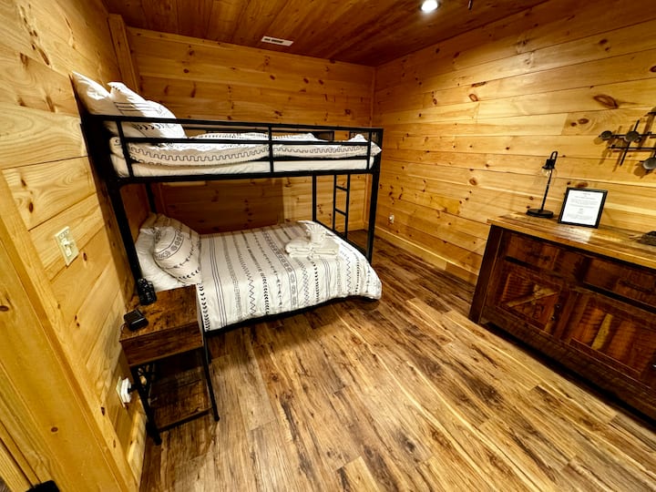 Bunk Bed Room - Upper & Lower Mattress are Full Sized Mattresses; Upper Bunk does have a weight restriction, upper can accommodate a child or pre-teen.