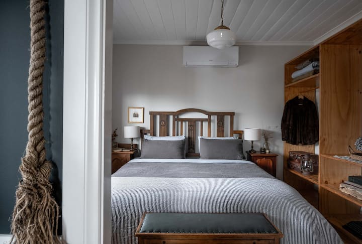 Master bedroom with King bed. Adorned in luxurious French flax linen sheeting, with adjustable memory foam pillows and a hotel quality mattress. All linen and towels are included.