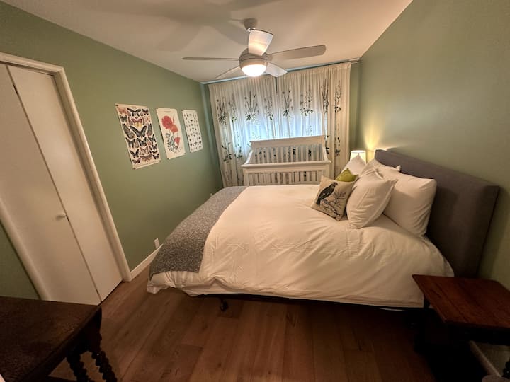 Bedroom #2 - a quiet, comforting room with a Queen bed and crib. A changing table is available, along with high chairs and packnplay. The house is child friendly.
