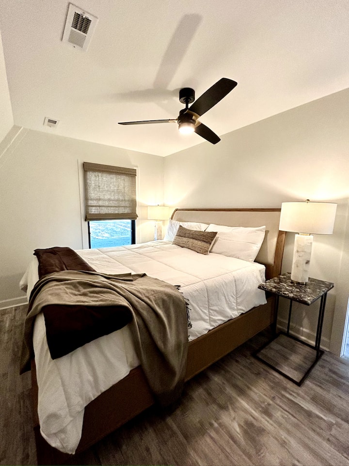 This is the main bedroom. It has a king bed and is connected to a full bathroom and a closet.
