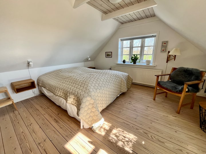 Welcome to Room 1, a bright and spacious bedroom, with double bed (180x200). Windows facing south and east - i.e. with morning sun. 
Guarantee of the best night's sleep is not given, but if you come from the city, you will notice the silence. 