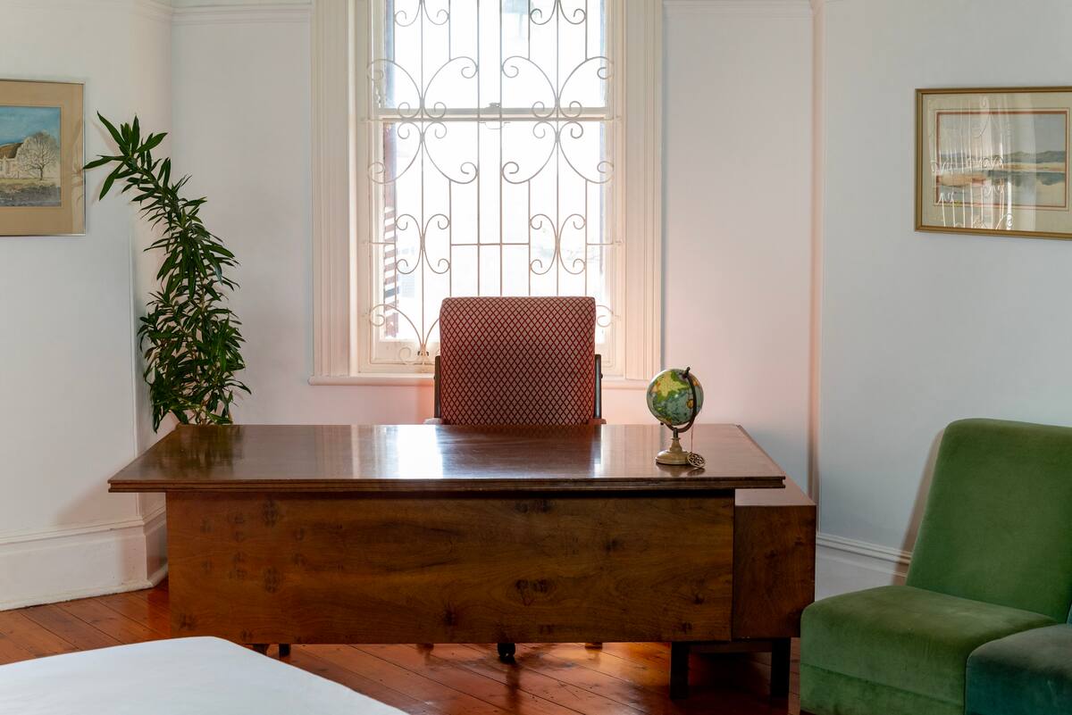 Private desk and workspace in the fireplace room at Utopia co-living Fresnaye