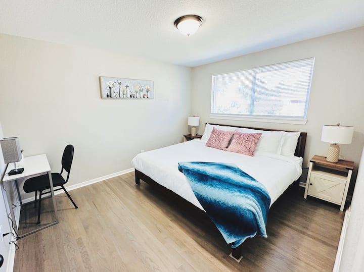 Main level bedroom with King bed and desk