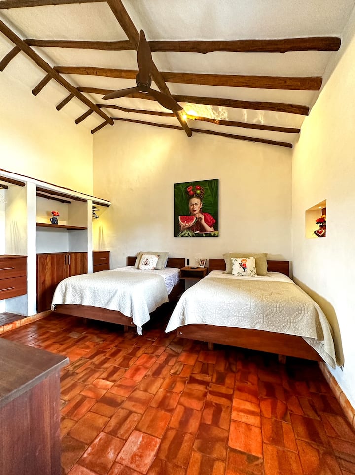 Frida: It's room No.2, spacious with 2 double beds, closet, ceiling fan with remote control, 55"SMART TV with sound bar and private bathroom.