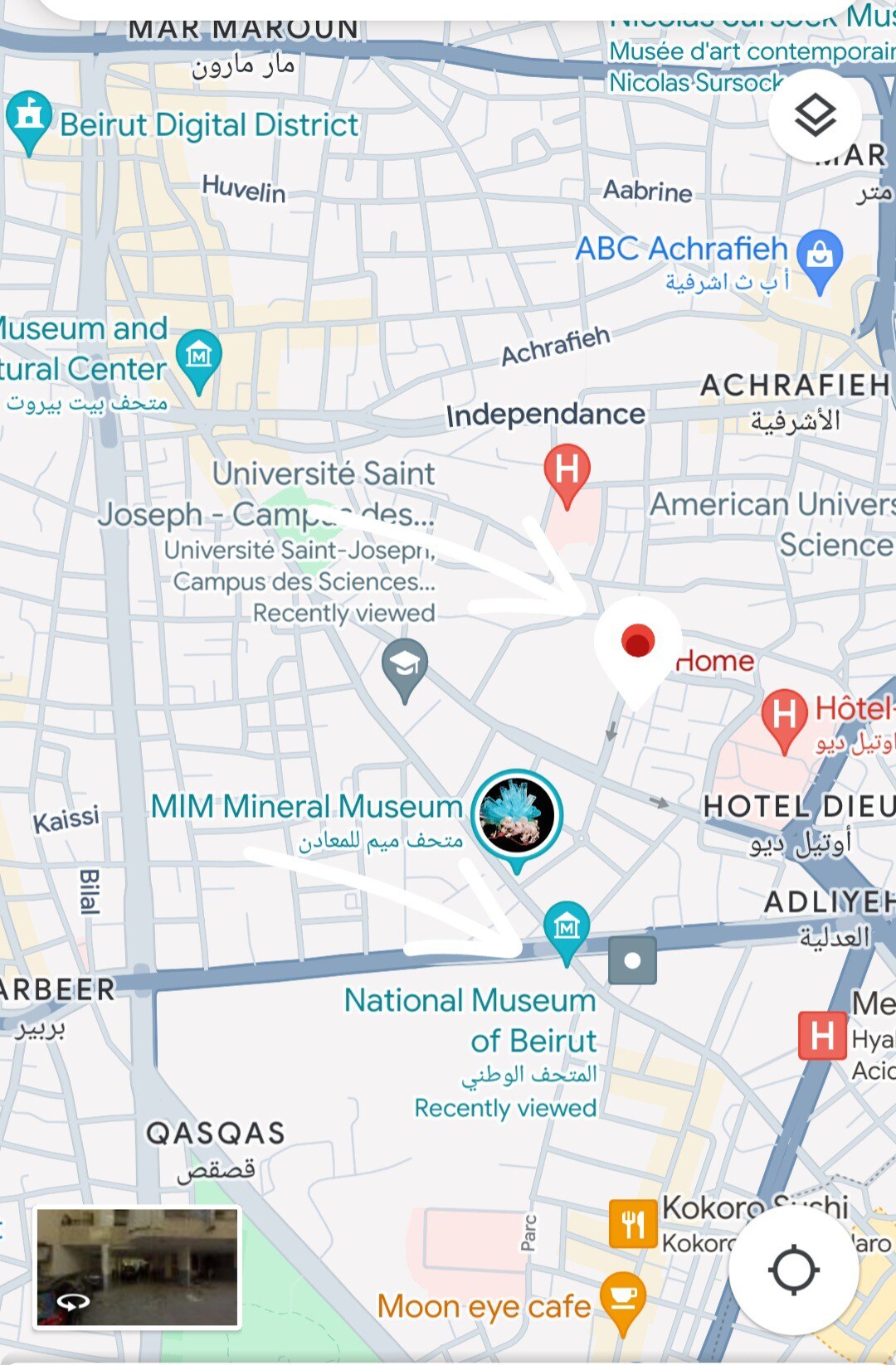 The image features a detailed map of the Achrafieh area in Beirut, showcasing key landmarks such as universities, museums, and the proximity to various facilities. Streets and district names are visible to provide orientation and context for visitors to the location.