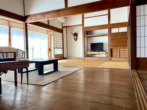 An entire traditional house in front of Surf Point