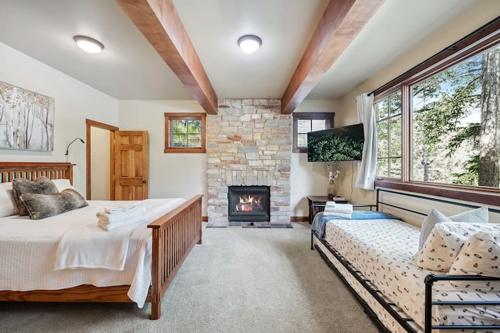 The downstairs bedroom has a welcoming fireplace and can sleep 4 guests (one queen bed, twin daybed and trundle)