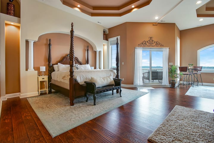 Luxury Master bedroom 1 , with lounge , balcony nook overlooking the water, and a bathroom of your dreams ! 2nd floor wing . 