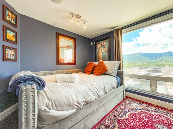 Bold hues, soft textures, and a view that inspires: this bedroom is a sanctuary with soul.