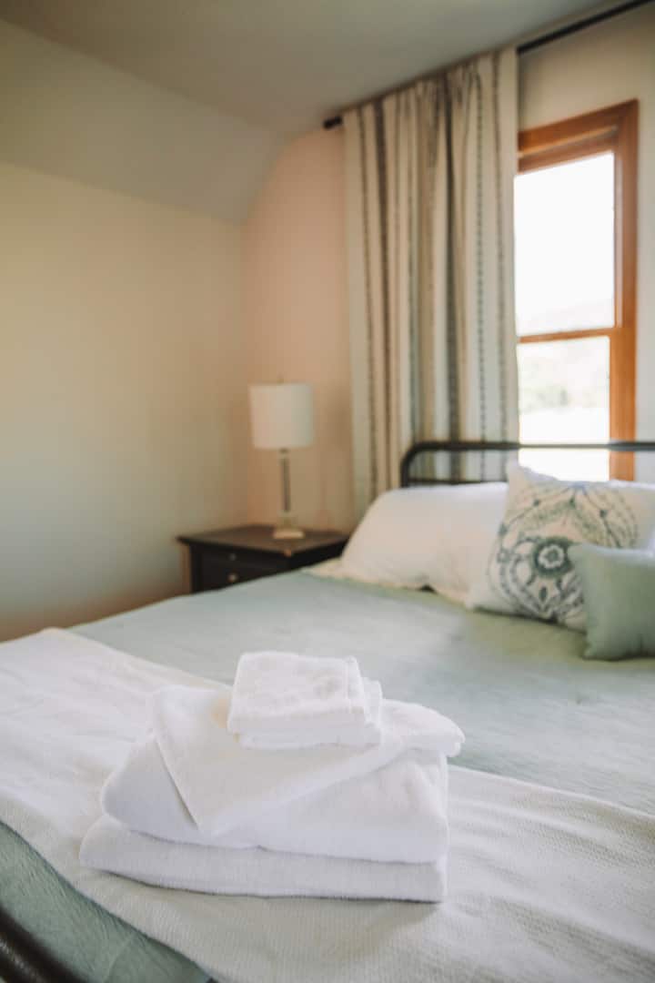 A calming retreat on the 2nd floor with blackout curtains for a restful nights sleep. 
This room is large with a desk area and a large walk in closet.