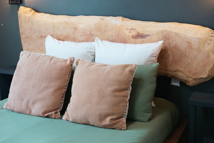 Sleep soundly in the serene and comfortable full-size bedroom, including comfortable pillows and bedding, and handcrafted live-edge wood backboard crafted by local Washington Artisans. Can sleep 2.