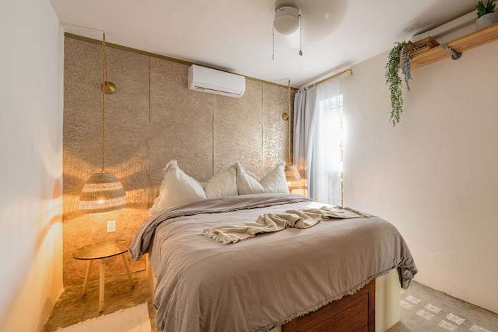 The queen bed in the bedroom 