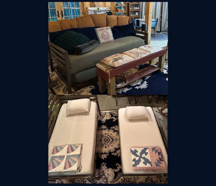 This couch converts into a trundle bed with two twin size foam mattresses (very comfortable! with no springs or bars). The beds are made with fitted sheets underneath the couch cover. (extra pillows, sheets, and blankets are in a chest)