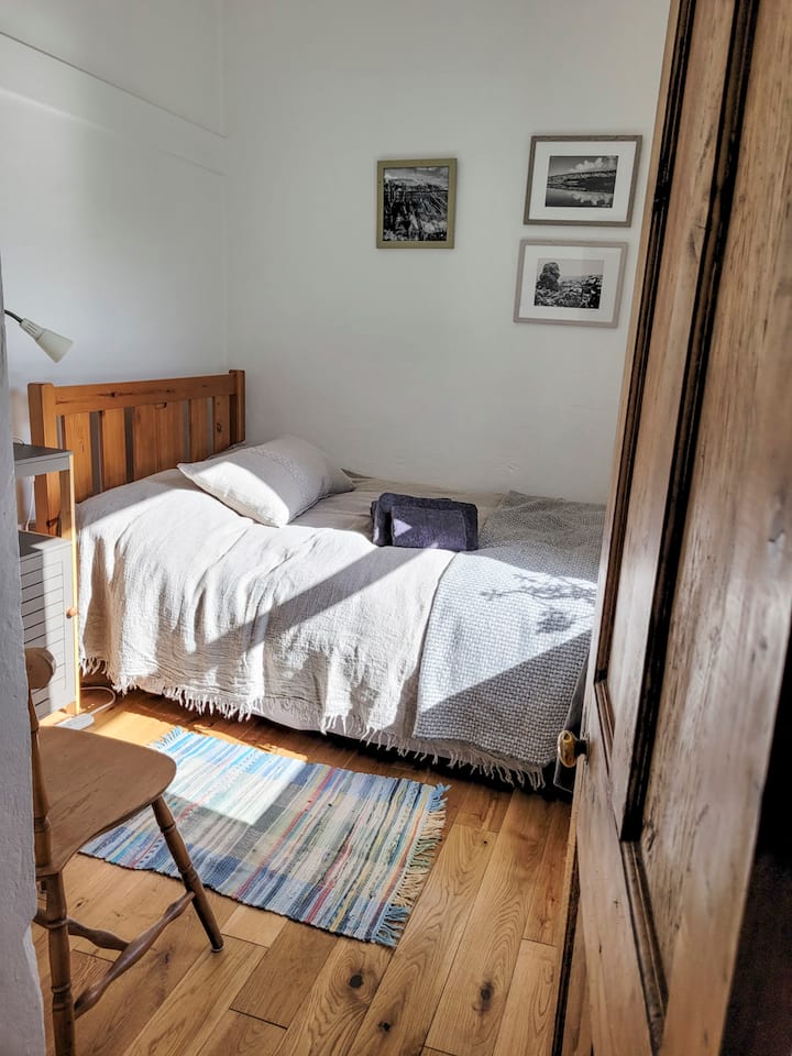 Small Single bedroom with European standard small double bed (120 cm x 190 cm) with down duvet and pillows.
