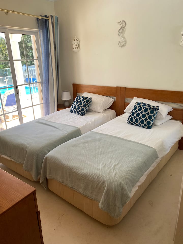 Bedroom 3 with ensuite bathroom. and direct access to pool area