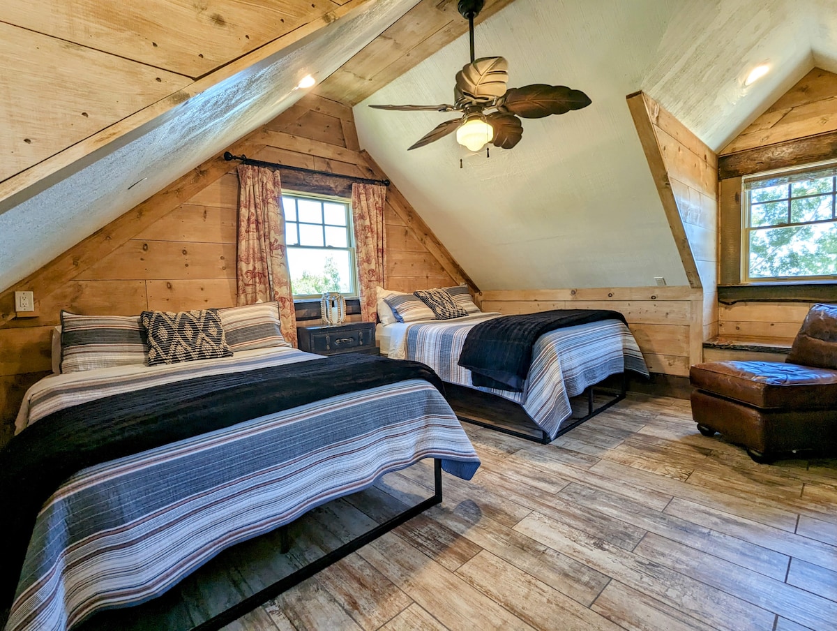 Lodge bedroom featuring 2 double beds and walk-in closet