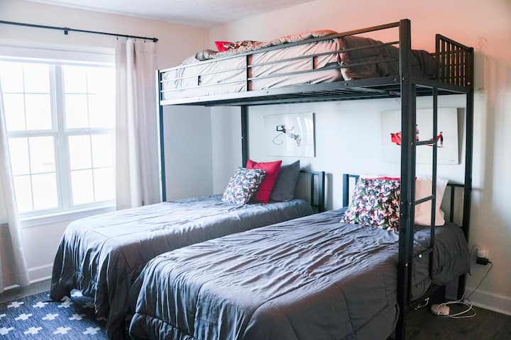 3 bunkbeds for a great time with family or friends, this room also has a fully stocked NERF gun armory for more fun + games! There is a TV in this room, with a game shelf as well. Let the good times roll!